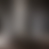 A pixelated grayscale image with vertical gradient bands transitioning from light gray to dark gray, no discernible subjects or text.