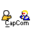 Pixel art animation of a character with blonde hair and red eyes emitting a blue energy beam from a device, with a yellow figure and white sphere in background.