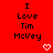 Red background with black text reading "I Love Tim McVey" and two white pixelated hearts below the text.
