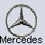 Static pixelated icon featuring a circular Mercedes-Benz logo above the text 'Mercedes' on a light gray background.