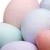 A highly pixelated static image of a pastel-colored abstract shape with soft gradients and blurred edges, lacking clear subjects or text.