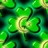 Green pixelated icon with four leaf clover shape and central yellowish core, surrounded by dark green background.