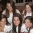 Six pixelated figures in white tops and dark bottoms pose together against a blurred background with visible architectural elements.