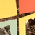 A static image with four colored quadrants—yellow, red, light blue, and yellow—divided by dark brown lines, with partial pixelated figures visible in the lower quadrants.