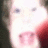 Pixelated close-up of a light-colored animal face with dark eyes and pink nose, partially cropped on left side.