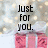Pixelated image with black text 'Just for you.' above pink gift boxes on a blurred background.