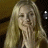 A 48x48 pixel buddy icon split into two frames showing a woman with long blonde hair on the left and green text reading "Original Icons .com" on the right against a dark background.