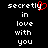 Pixelated text reads 'secretly in love with you' with a red heart replacing the 'y' in 'secretly' on the left side of the image.