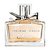 Pixelated image of a rectangular perfume bottle with a metallic pump top, light brown liquid inside, and a label with faint horizontal stripes.