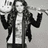 Black-and-white photo of a person in a jacket and jeans with cyan text reading "gonna pull up my old blue jeans" on a split background.