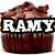 A chocolate cupcake with brown frosting and a small chocolate piece on top, overlaid with text that changes across frames.