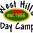 Animated icon features green oval with yellow border containing red text over 'West Hills Day Camp' text, with red text changing across frames.