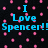 Pixelated text reads "I Love Spencer!" in cyan against a black background with scattered pink squares.