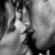 Animated contact sheet of a kissing couple with text overlays across frames showing progression from closed eyes to open mouth kiss and partial text display.