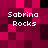 Pixelated of magenta and black squares with white text reading "Sabrina Rocks" in four positions