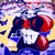 Pixelated cartoon character with red and dark blue body, white face, and yellow background with scattered dark blue shapes.