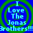 Blue background with green concentric circles and light blue text reading "I Love The Jonas Brothers!!!" repeated in a pattern