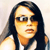 Pixelated image of a person with long dark hair wearing a white sleeveless top against a light background.