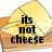 Pixelated cheese wedge on wooden surface with text 'its not cheese' and 'its cheez' in black font, yellow crosshair overlay.