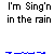 Pixelated character with white head and orange body sings under blue raindrops on gray background with text "I'm Sing'n in the rain".