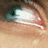 A close-up of a human eye with light skin tone, showing subtle animation changes in the iris and eyelid position across frames.