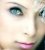 Pixelated close-up of a human face showing eyes, nose, and lips with visible pixelation artifacts.