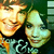 Two pixelated faces in close proximity, one with light brown hair and the other with greenish-yellow tones, both smiling against a dark background.