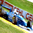 Animated contact sheet showing three sequential frames of a blue race car on a track with visible branding and motion blur effects.