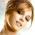 Pixelated close-up of a person's face with brown hair and light skin tone, static single-frame image.