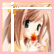 Pixelated anime-style character with brown hair and red lips, wearing a white top against a pink background.