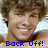 A pixelated image of a smiling person with brown hair, overlaid with blue text reading "Back Off! He's Taken." and "By Me. =]" on separate sections.