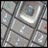 Static pixelated image with abstract light and dark gray patterns, no discernible subjects or text.