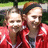 Two people in red jackets appear in a pixelated photo on a red background with white text reading 'Kristen and I' and 'States <33'.