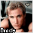 A pixelated image of a person with light brown hair wearing a black sleeveless top, with the name 'Brady' displayed below and a heart symbol above.
