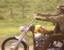 A 4-frame animated contact sheet showing a person riding a motorcycle with slight motion differences between frames.