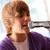 A person with light brown hair wearing a purple cardigan over a white shirt appears in four showing sequential facial expressions and head movements