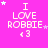 A bright pink background displays the text "I LOVE ROBBIE <3" in white pixelated font, with small white stars scattered around the text.