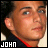 Static 48x48 pixel buddy icon showing a close-up of a person's face with visible text "JOHN" in white block letters at the bottom left, set against a dark background with red and black clothing details.