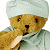 A pixelated cartoon teddy bear wearing a white turban and light gray robe with one paw raised to its mouth, next to green text reading "Original Icons .com" on a dark green background.