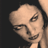 Static 48x48 pixel icon showing a close-up of a person's face with dark hair against a black background, rendered in low-resolution pixel art style.