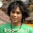 Pixelated image of a person with dark curly hair wearing a green shirt, with 'boo boo!' text at the bottom.