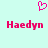 A static pixel art image with a light cyan background, featuring two identical pink text labels and one pink heart symbol above them.
