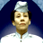 Pixelated static image of a character wearing a tall white chef's hat and dark earpieces against a blue gradient background with white lower section.