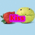 Animated sequence showing a yellow spherical character with two small black eyes and a closed mouth kissing a red strawberry-like fruit, with the word 'Kiss' in pink text overlay.