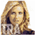A pixelated image of a person with long blonde hair wearing a dark top, overlaid by diagonal text in various colors across the face.