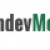 Pixelated logo with partial text 'ndeyM' in dark gray and green, set against a gray and white checkered background pattern.