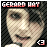Pixelated static icon featuring a person's face with text at the top and a small symbol in the bottom right corner, set against a dark checkered background.