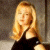 A pixelated image of a woman with long blonde hair wearing a black top, positioned next to green text reading 'Original Icons .com' on a dark background.