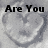 A grayscale animated icon with a heart-shaped background and text reading "Are You Cold Hearted? Join TccS7" in black pixelated font.