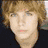 Four-person with red text overlay on black background; top-left person has light brown hair, top-right holds a phone, bottom-left looks downward